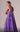 Back view of MNM Couture Gown showcasing the long, sweeping Cape Train, Purple