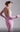 MNM Couture Gown back view, showcasing Beaded Halter Neckline, Open Back, and matching Pink Gloves