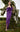 MNM Couture Purple Strapless Gown with Pleated Bodice and Knotted Waist, ideal for a Black Tie Gala