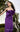 MNM Couture Purple Strapless Gown with Pleated Bodice, Knotted Waist, and Center Slit for a Formal Event