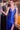 Close-up of Ladivine royal blue evening gown, showing intricate rhinestone beading, deep V-neck sheer illusion panel, and high leg slit detail.