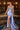 Ladivine Cielo Blue satin evening gown with structured sheer corset bodice, sweetheart neckline, silver beading, and high side slit.