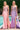 Ladivine dusty rose and lavender satin evening gowns, both featuring structured sheer corset bodices with silver beading, sweetheart necklines, and dramatic high side slits with ruched details.