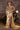 Ladivine gold satin evening gown with structured sheer corset bodice, plunging sweetheart neckline, gold rhinestone beading, and high side slit with flowing train.
