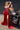 Ladivine red strapless satin high slit beaded corset gown and silver fitted formal dress on a motorcycle