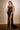 Model is posing in the Cinderella Divine CD868 dress in the color black