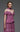 Close up of MNM Couture dusty rose off-shoulder evening gown with pleated bustier and scarf detail