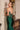 Emerald green corset-back gown detail. LaDivine strapless dress back view showing sheer boning and fit.