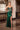 LaDivine C172 emerald green strapless prom dress with beaded sweetheart corset bodice, sheer plunging V-neck, high leg slit, and shimmering full-length satin mermaid skirt.
