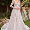 Model is posing in the Cinderella Divine CD862W wedding dress