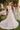 Model is posing in the Cinderella Divine CD862W Wedding dress