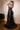 Model is showing off the back of the Cinderella Divine CD868 dress in the color black 