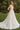 Model is posing in the Cinderella Divine CDS436W wedding dress