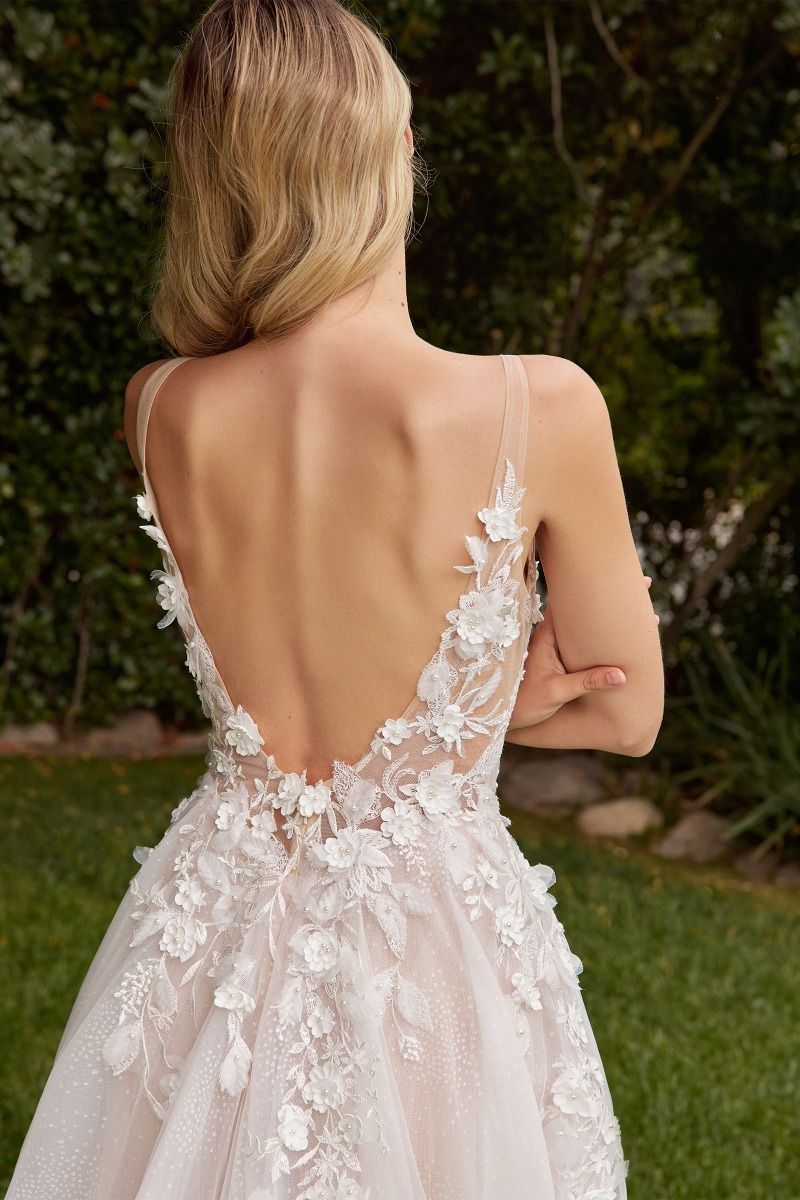 Model is showcasing the back of the Cinderella Divine CDS436W wedding dress