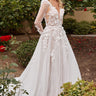 Model is posing in the Cinderella Divine CDS436W wedding dress