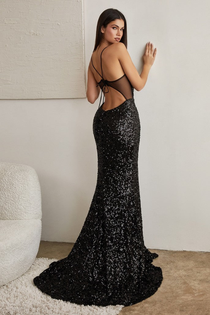 Woman in black sequin gown CH127 leaning against a wall